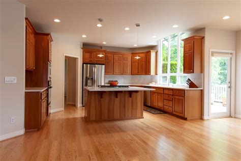 stainless steel vs black stainless with honey oak cabinets|honey oak kitchen cabinets.